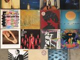 a lot of records on the floor of this room