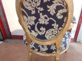 a chair that has a blue and white pattern on it