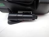a close up of a camera on a white surface