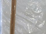 two wooden sticks sticking out of a plastic bag