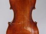 an old violin with a wooden back and a long neck