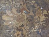 a picture of a decorative wallpaper with flowers and birds on it