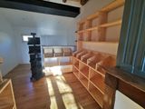a room with a lot of bookshelves in it