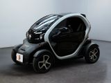 a small car that is sitting in the middle of a room