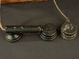 an old fashioned telephone with a cord attached to it