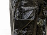 the back of a black leather jacket hanging on a clothes rack