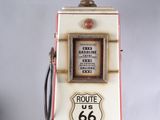 an old gas pump with a route 66 sign on top