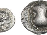 une image représentant une pièce d'argent sur laquelle figure un visage