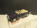 a toy car that is sitting on top of a box