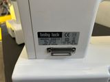an image of a close up of a sewing machine on a table