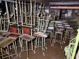many chairs and tables in a room with a lot of them