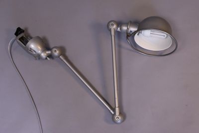 two lamps that are on a table next to each other