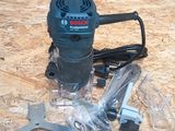 a corded sander and tools on the floor of a room
