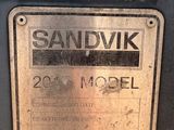 a sign that says sandvik on the side of a machine