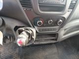 a close up of a car dashboard with a bottle of water in it