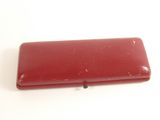 a red case that is sitting on a white surface