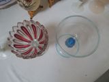 a glass bowl and a glass bowl on a table