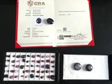 a box of gems and a certificate on a table