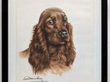 tableau représentant un chien brun dans un cadre noir accroché à un mur blanc