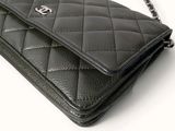 a picture of a black chanel purse on a white background