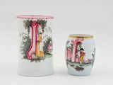 two vases sitting next to each other on a white surface