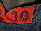 a close up of a red and blue patch on a pair of jeans