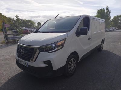 the white van is parked on the side of the road