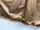 a close up view of a bed with a sheet on top of it
