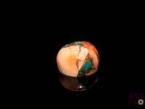an image of a marble ball sitting on top of a black surface