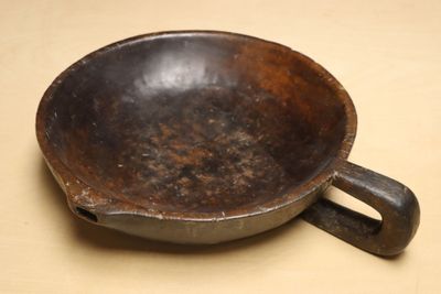 a brown bowl that is sitting on a table