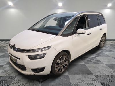 the white van is parked on a checkered floor in a garage
