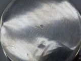 a close up of a silver watch on a table