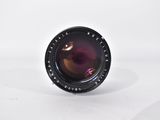 a close up of a camera lens on a white surface