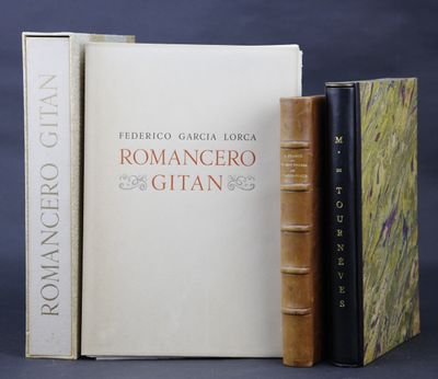 two books sitting on top of each other next to each other