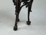 a small table that has a clock on top of it