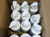 a lot of white cups in a box on the floor