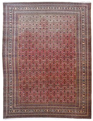 un tapis persan ancien aux couleurs rouges et beiges