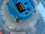 an image of a blue and black electronic device in a plastic container