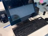 a laptop computer sitting on top of a white desk
