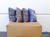 a cardboard box with a bunch of pillows on top of it