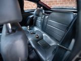 a black car with black leather seats in the back of it
