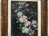 an oil painting of flowers in a wooden frame on a white wall