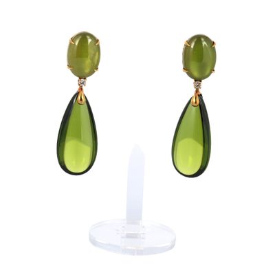 pair of green and gold earrings on a white background