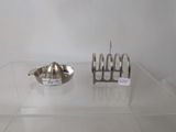 a silver object on a glass table next to a silver object