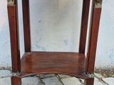a small wooden table with a shelf on top of it