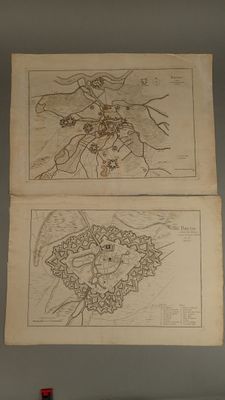 two drawings of a man and a woman on a wall