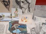 a lot of drawings on a table with a red background