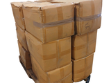 a stack of boxes on a pallet with a strap