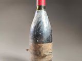 a bottle of wine that has been wrapped in plastic