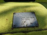 a metal plaque on the back of a green truck
